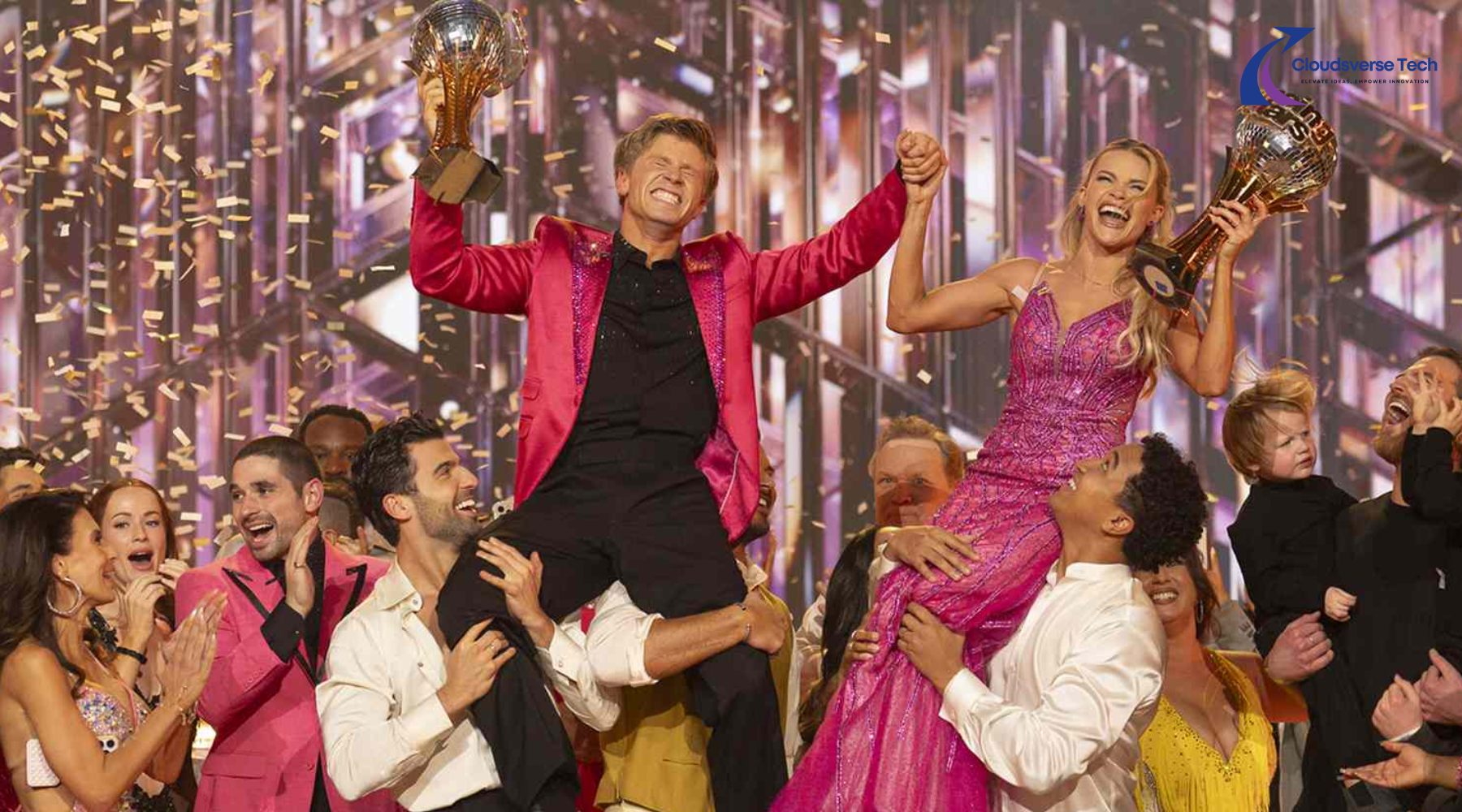 Robert Irwin and Witney Carson celebrate with Mirrorball Trophy at Dancing With the Stars Season 34 finale.