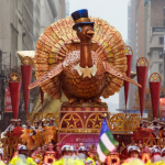 A cozy Thanksgiving dinner table with roast turkey, autumn decorations, and warm candlelight