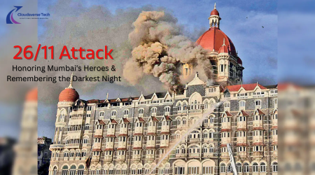 26/11 memorial tribute with candles and Taj Mahal Palace Hotel in the background.
